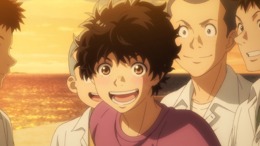 Aoashi - Ashito beaming among the townspeople at sunset in episode 5